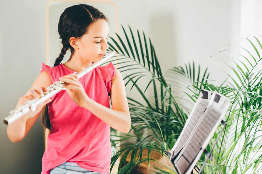 A girl practicing the flute