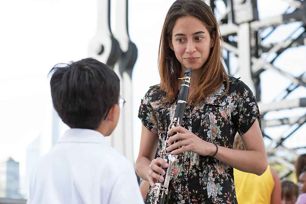 Clarinet teacher giving a demonstration at a public event