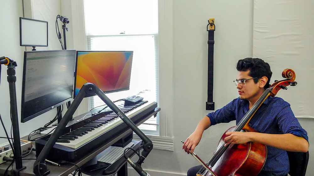 Cello teacher giving an online lesson