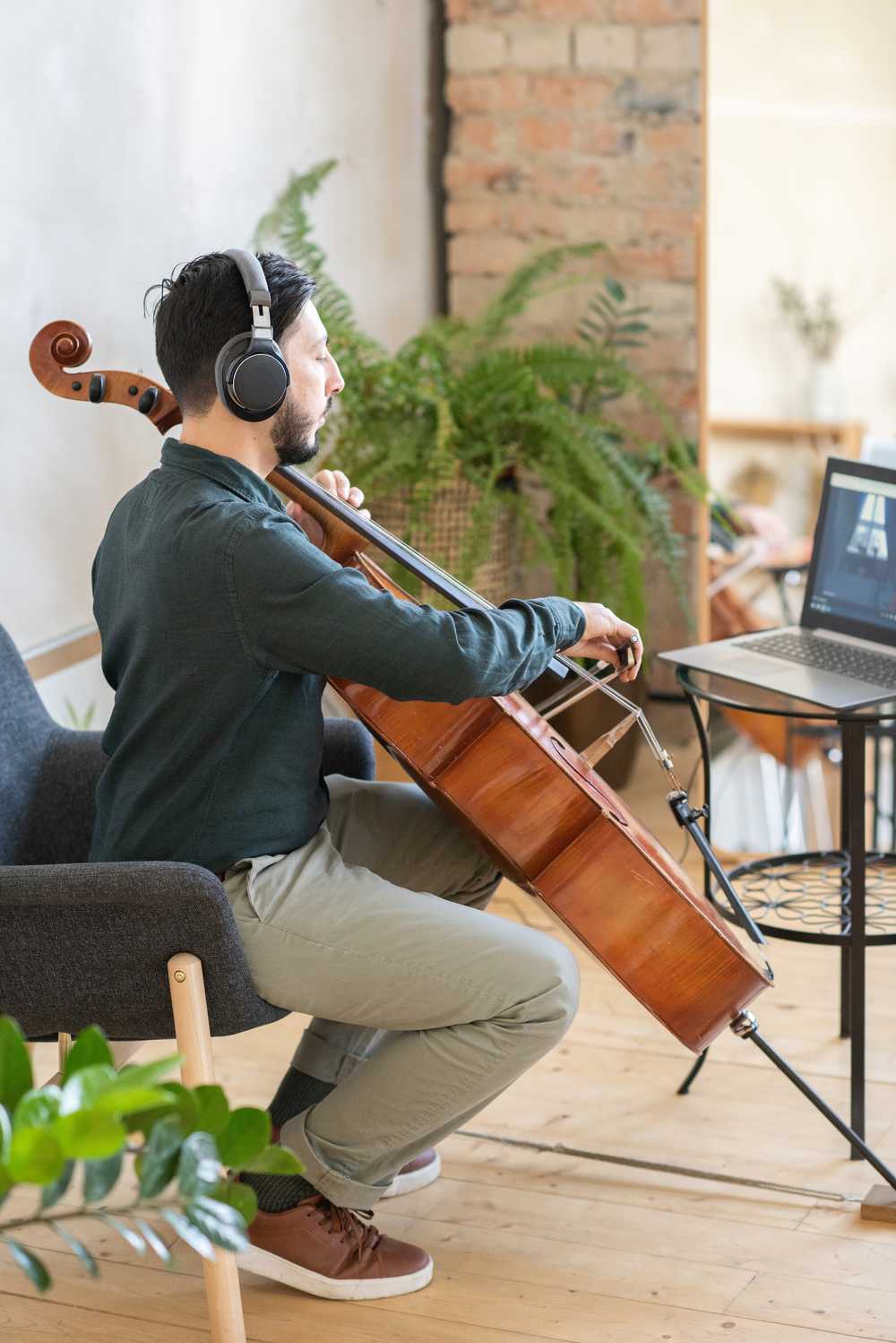 Young man playing cello online